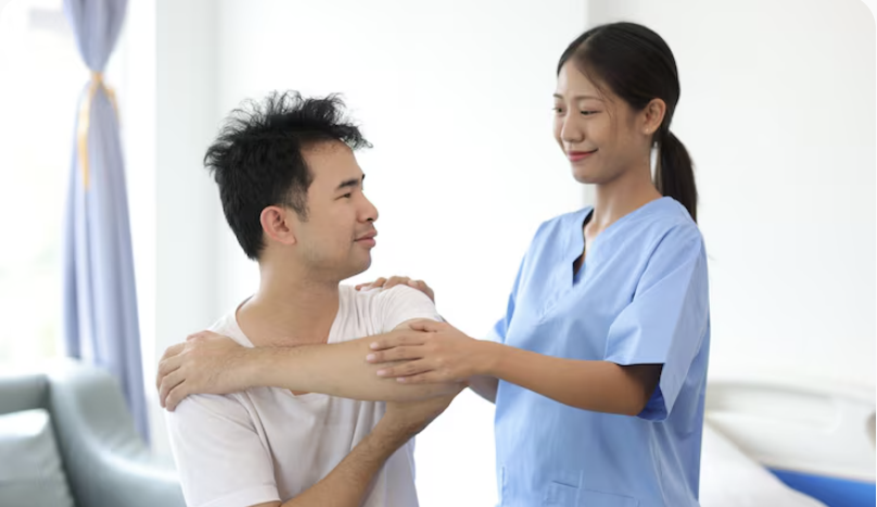 physiotherapist helping a patient