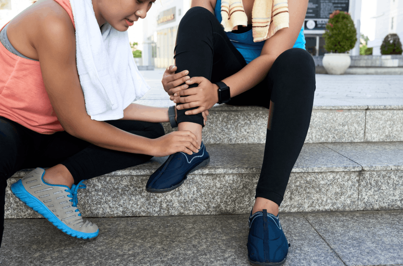 a friend holding onto a sprained ankle