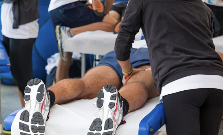athlete getting massaged by physiotherapist