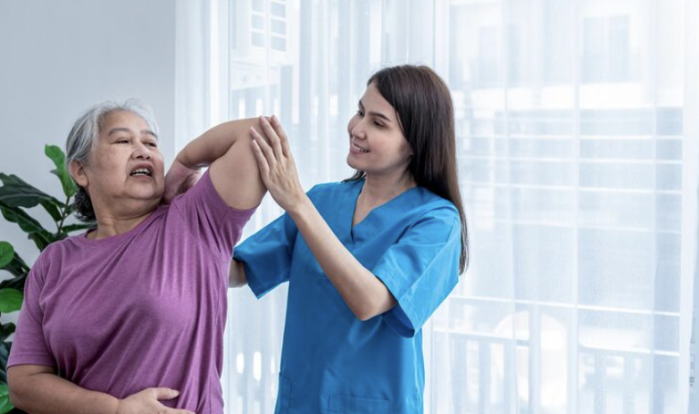 physiotherapist treating an elderly patient