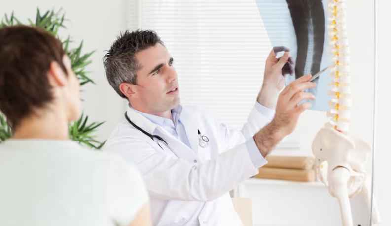 doctor explaining the spine to a patient