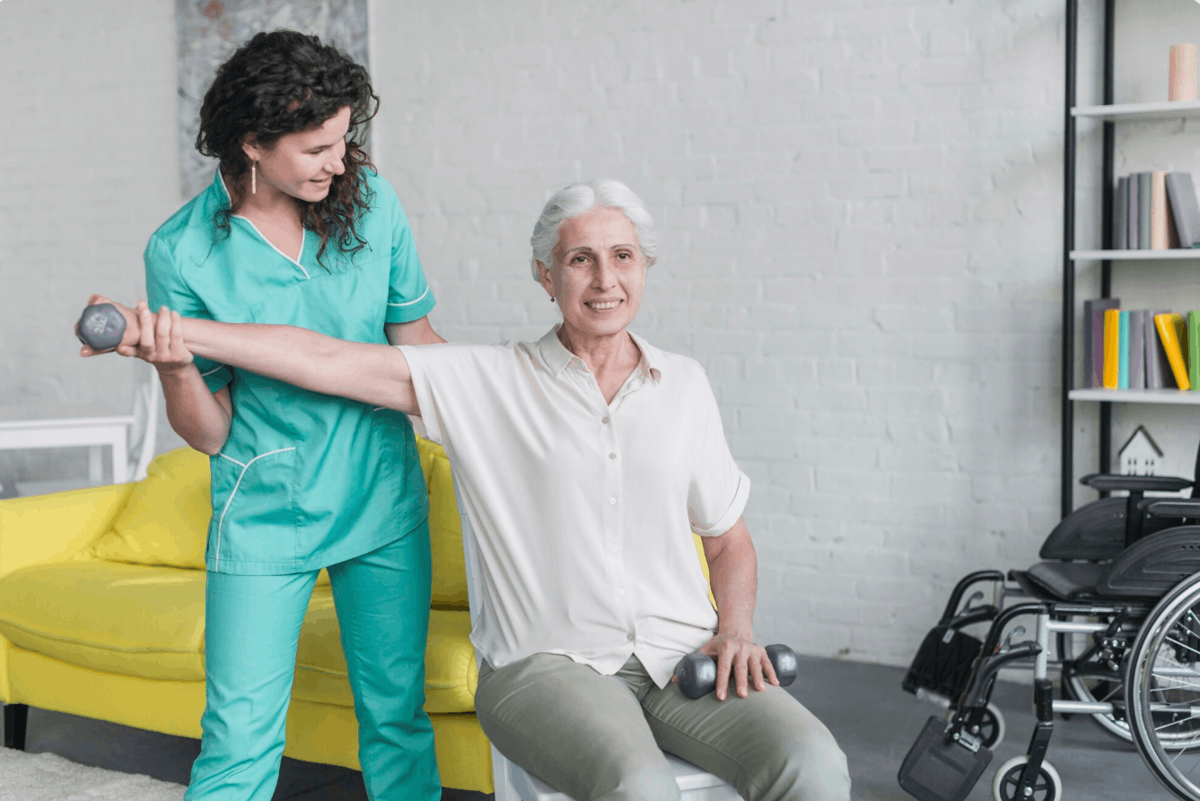 physiotherapist guiding an elderly patient on how to exercise at home