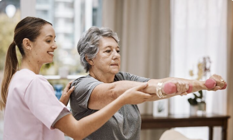 physiotherapist guiding elderly patient on how to exercise lightly