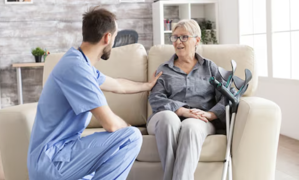 physiotherapist checking on a patient in her home
