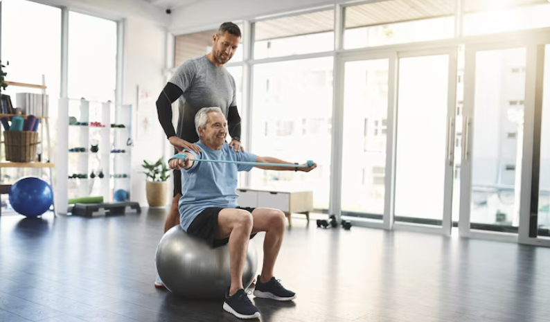 physiotherapist guiding elderly patient for mobility